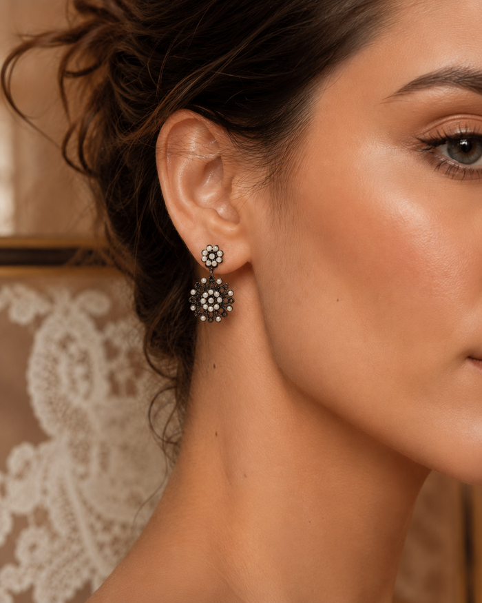 Merletti 04 Petite Drop Earring in Black Pearl shown worn to demonstrate its actual proportions and delicate scale.