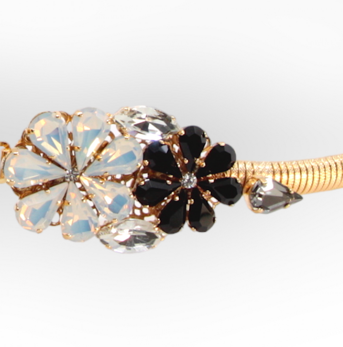 Daisy Black Crystal Flower Belt in stretch gold metal mesh with black and opaline floral crystal buckle