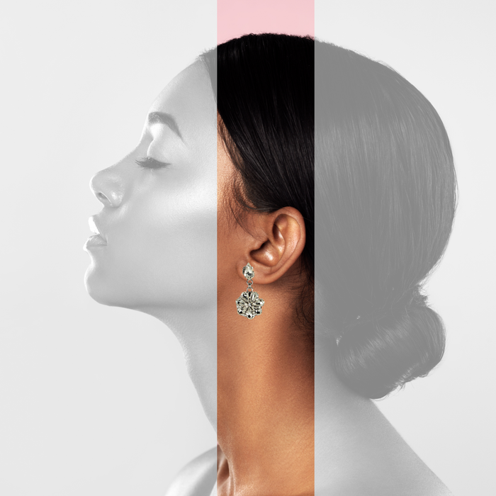 Daisy-shaped drop earrings with crystal drops on a rhodium-plated base