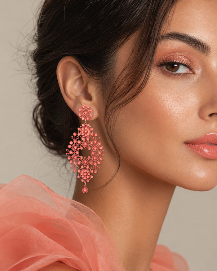Merletti 03 Openwork Drop Earring in Coral Rose shown worn to demonstrate its actual proportions and overall dimensions.