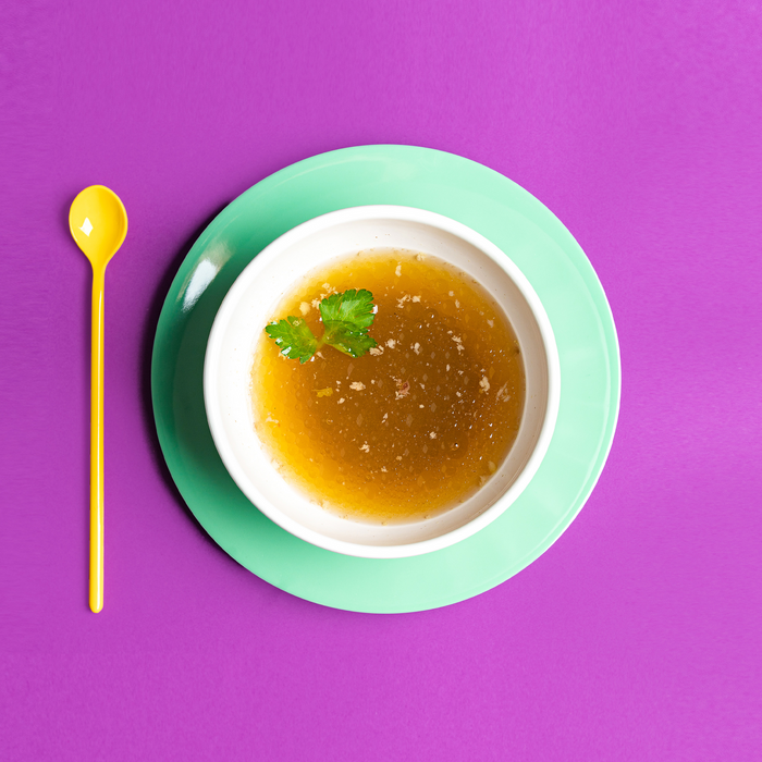 Miracle Bone Broth ingredients — organic grass-finished beef bones and aromatic vegetables