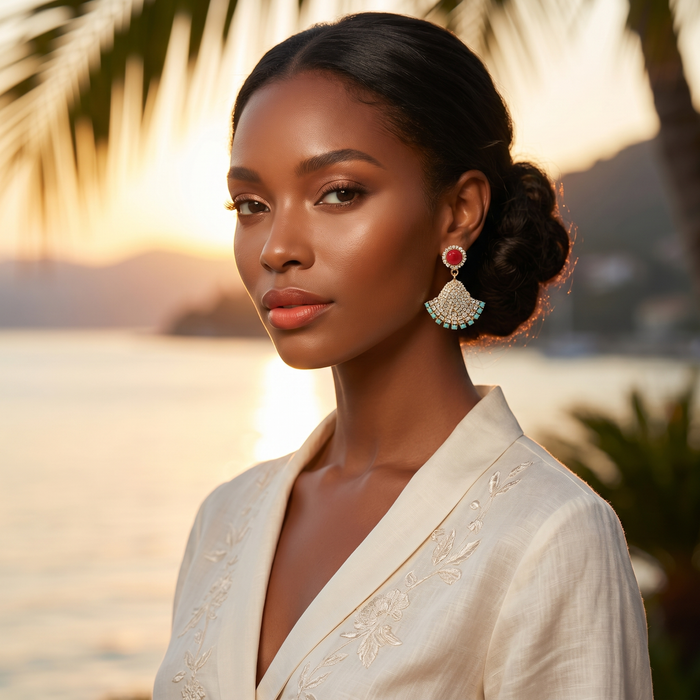 Venere Coral Fan Earrings with coral-tone cabochon, crystal pavé fan motif and turquoise accents

Statement gold-tone fan earrings with red coral-style top and sparkling crystal embellishment

Mediterranean-inspired drop earrings from the Venere Capsule Collection

Venere Coral Fan Earrings worn with elegant evening styling